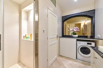 a laundry room with a washer and dryer at Elegant apartment in Nice centre with grand terrace in Nice
