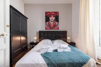 a bedroom with a bed with two towels on it at MY CASA - ETATS UNIS 892 - Spacious flat on Sea front w AC in Nice