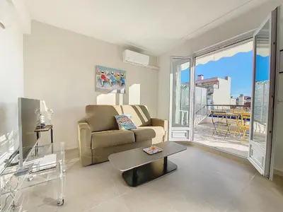 a living room with a couch and a table at Nestor&Jeeves - CIEL AZUR - Terrace in Nice