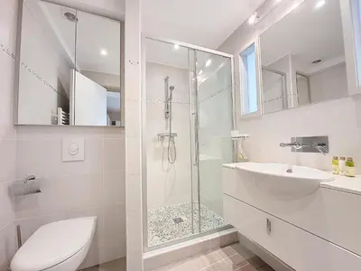 a bathroom with a shower and a toilet and a sink at Nestor&Jeeves - BAIETA - Balcony in Nice
