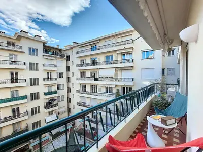 a balcony of a apartment building with two chairs at Nestor&Jeeves - BAIETA - Balcony in Nice