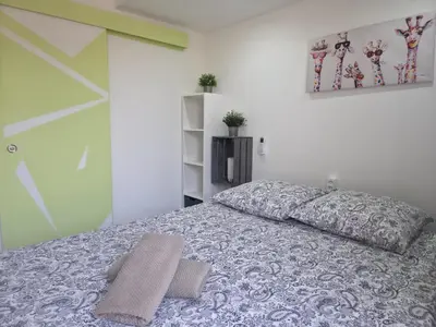 a bedroom with a bed with two pillows on it at Le Virenque in Nice