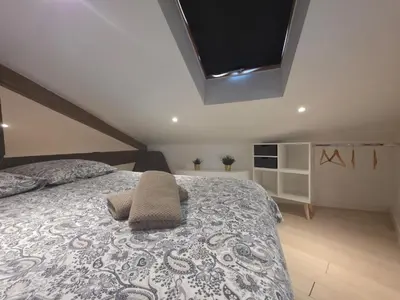 a bedroom with a bed with a pillow on it at Le Virenque in Nice