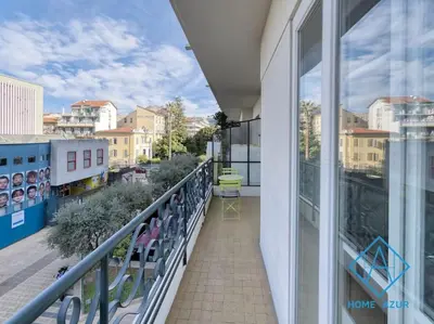 a balcony of a building with a view of a city at NEW Luxurious apartment - Jean Medecin in Nice
