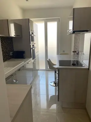 a kitchen with a sink and a counter top at Magnifique appartement avec vue sur mer in Nice