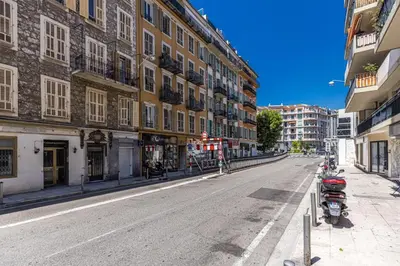 an empty street in a city with buildings at Walesa- wifi, AC, 3 pers in Nice