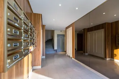 a hallway with a wall of wine bottles at Franck Pilatte - Parking, Wifi, AC, 3pers in Nice