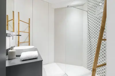a bathroom with a glass shower and a sink at Franck Pilatte - Parking, Wifi, AC, 3pers in Nice