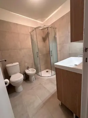 a bathroom with a shower and a toilet and a sink at Suite Aquarius FSHH in Nice