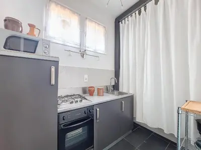 a kitchen with a stove and a sink at Nestor&Jeeves - PROVENCAL - Central - Near Beach in Nice
