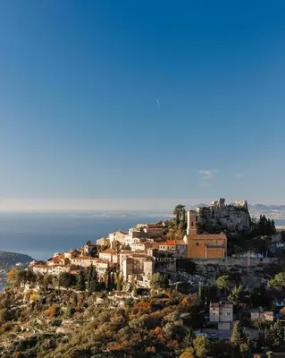 a town on top of a hill with houses at Maison de 6 pièces au coeur du village d'Eze in Èze