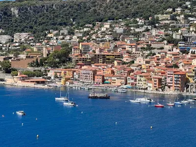 a group of boats in the water near a city at Loft - centre historique in Villefranche-sur-Mer