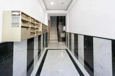 a hallway with black and white stripes on the wall at L33 2P Jean Médecin centrale/ 2 Balcony & AC in Nice