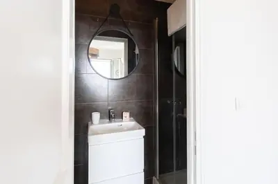 a bathroom with a white sink and a mirror at L33 2P Jean Médecin centrale/ 2 Balcony & AC in Nice