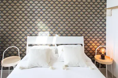 a bedroom with a white bed with two chairs at L33 2P Jean Médecin centrale/ 2 Balcony & AC in Nice