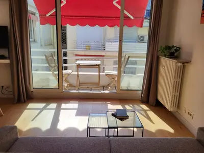 a living room with a couch and a table and chairs at #TheCosyStudio06 Meyerbeer Promenade Negresco in Nice