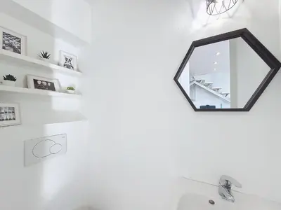 a mirror on a wall above a sink in a bathroom at Nestor&Jeeves - ECLAT NICOIS - Central - Near beach in Nice