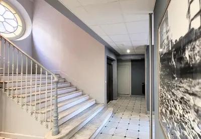a hallway with stairs in a building with a window at Nestor&Jeeves - ECLAT NICOIS - Central - Near beach in Nice