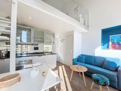 a living room with a blue couch and a table at Nestor&Jeeves - ECLAT NICOIS - Central - Near beach in Nice