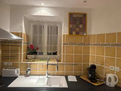 a kitchen with a sink and a window in it at Le ville franche in Villefranche-sur-Mer