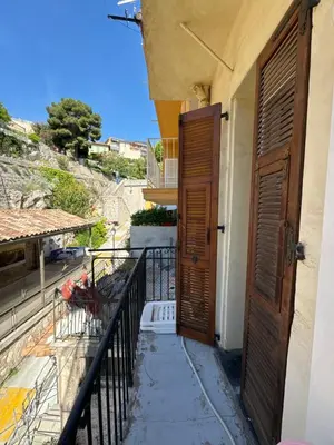 an open door of a building with a balcony at Le ville franche in Villefranche-sur-Mer