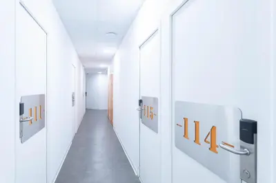 a corridor of a hospital hallway with a hallway at Résidence de l'Alliance in Nice