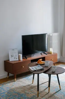 a living room with a tv and a coffee table at Serenity chic apartment Nice center in Nice