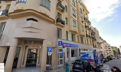 a building on the side of a city street at Serenity chic apartment Nice center in Nice