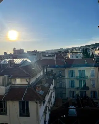 a view of the roofs of buildings in a city at Studio de charme hyper centre in Nice