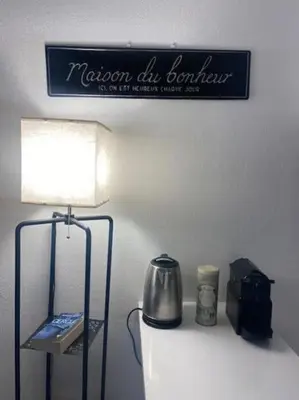 a sign on the wall above a toilet in a room at Bottero-Joli Studio avec terrasse 5 mins de la mer in Nice