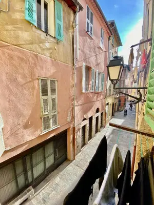 a view of an alley with buildings and a street at Logement Atypique in Villefranche-sur-Mer