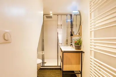 a bathroom with a shower and a toilet at LA TREILLE AP4334 By Riviera Holiday Homes in Nice