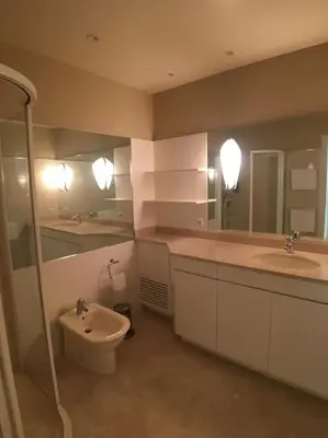 a bathroom with two sinks and a toilet and a shower at Appartement „Bellevue“ Villefranche-sur-Mer in Villefranche-sur-Mer