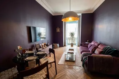 a room with a door and a table with a chair at Close to the beach behind the famous Negresco ! in Nice