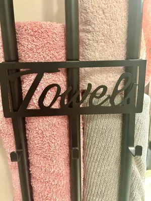 a metal gate with the word love on a pink towel at SuperbeStudio in Nice - 450m of the sea- garden view in Nice