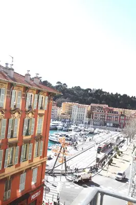 a view of a city with a marina and buildings at APPARTEMENT NICE le PORT in Nice