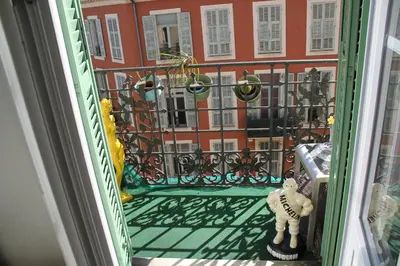 a balcony with a view of a building at APPARTEMENT NICE le PORT in Nice