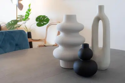 three white vases sitting on top of a table at L11 Claire Fontaine Sea view 2 BDR AC Parking swiming pool in Nice