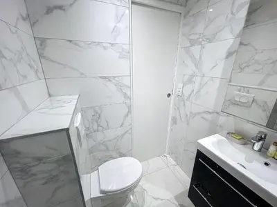 a white bathroom with a toilet and a shower at Nestor&Jeeves - PALMA BEACH - Proche Mer in Nice