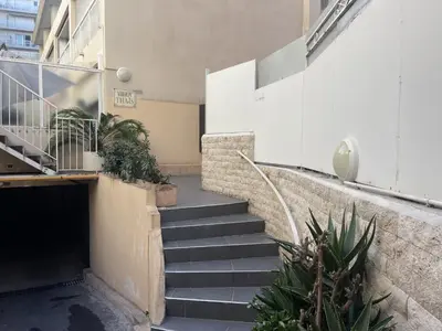 a set of stairs in a building with plants at Nestor&Jeeves - PALMA BEACH - Proche Mer in Nice