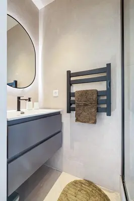 a bathroom with a sink and a mirror at Appartement Loulib I Electio in Nice