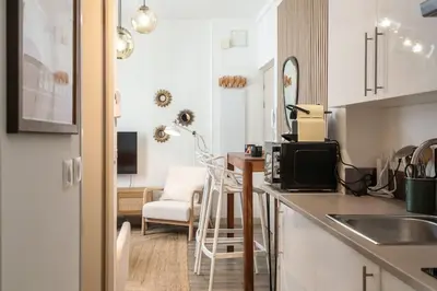 a kitchen with a sink and a desk in a room at L46 2P Port, 2min du Cap et 5 du port/ CLIM & WIFI in Nice