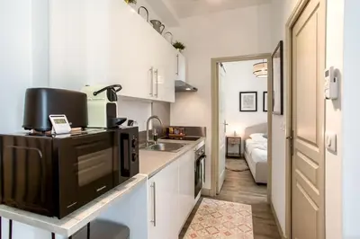 a small kitchen with a sink and a microwave at L46 2P Port, 2min du Cap et 5 du port/ CLIM & WIFI in Nice
