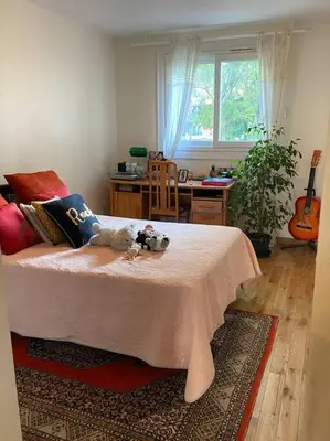 a bedroom with a bed with a stuffed animal on it at Angele Stephen in Nice