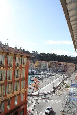 a view of a city with a marina and buildings at APPARTEMENT NICE le PORT in Nice