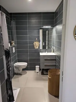 a bathroom with a toilet and a sink at Studio calme avec vue dégagée in Nice
