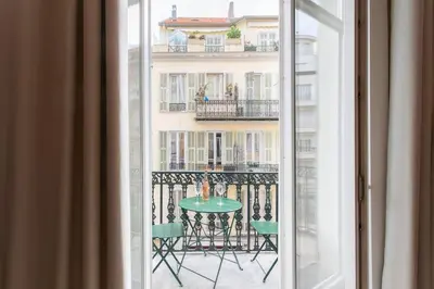 a view of a table and chairs from a window at L37 F1 Central 2 min de la mer Balcon & CLIM in Nice