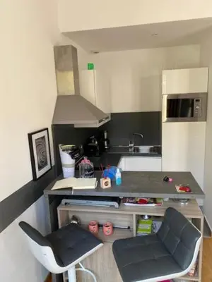 a small kitchen with a counter and a sink at Exceptional Terrace in Center of Nice in Nice