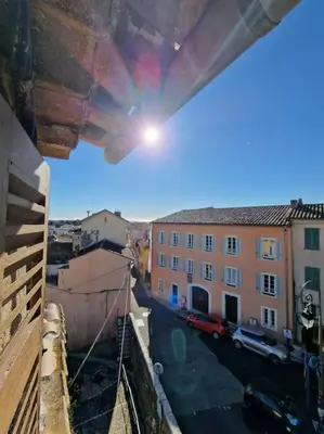 a view of a city street from a balcony at Duplex dans maison de village in Cagnes-sur-Mer