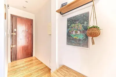 a hallway with a painting on the wall and a door at CENTRE VILLE-GRAND APPARTEMENT DE 50 M2 - COSY AVEC TERRASSE -Wifi in Nice